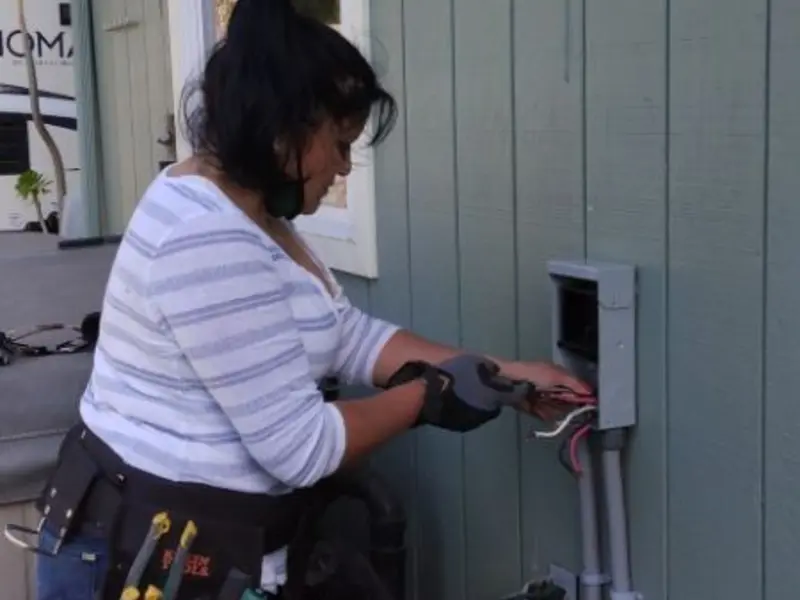 Licensed electrician wiring an exterior subpanel in Weldon Spring